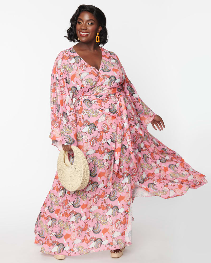 Front of a model wearing a size 4X Unique Vintage Pink Rooster Print Wrap Maxi Dress in Pink by Unique Vintage. | dia_product_style_image_id:287463